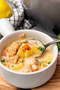 a white bowl filled with chicken and pineapple soup