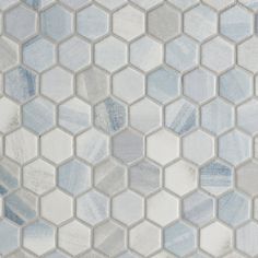 a white and blue hexagonal tile pattern