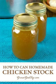 two jars filled with homemade chicken stock sitting on top of a blue towel next to a bowl