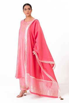 Lotus pink A-line kurta with embroidery along the neckline and sleeves. Paired with a pant and tissue applique work dupatta. - Aza Fashions Embroidered Chanderi Palazzo Set, Pink Palazzo Set With Embroidered Border And Straight Kurta, Pink Cotton Silk Kurta With Embroidered Border, Traditional Pink Palazzo Set With Embroidered Border, Pink Embroidered Palazzo Set For Diwali, Pink Straight Kurta Anarkali Set With Embroidered Border, Pink Cotton Silk Sets With Embroidered Border, Elegant Pink Anarkali Set With Embroidered Border, Pink Traditional Wear With Embroidered Border In Cotton Silk