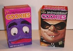 two boxes of mcdonald's cookies with faces painted on the front and back sides