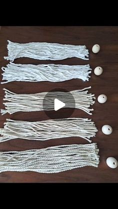 some white string and eggs on a wooden table