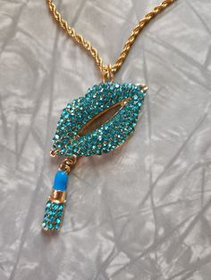 Blue rhinestone lips charm necklace. This is for 1 necklace. It is on a gold plated stainless steel 18 inch chain with a 2 inch extender. If you love statement jewelry than this piece is for you. Or wear to an 80's themed party.  If you have any questions please feel free to contact me.  Thank you for shopping at my store. Have a Totally Awesome Day! 😎 Trendy Bling Necklaces For Gifts, Trendy Bling Necklace For Gift, Trendy Necklace For Gift, Rhinestone Lips, Totally Awesome, Blue Rhinestones, Themed Party, Statement Jewelry, Charm Necklace