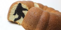 a bundt cake with an image of a man on it's side cut in half