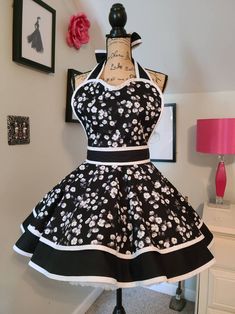 a black and white dress with flowers on it