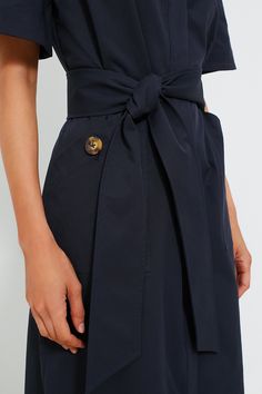 The Navy Jacqueline Maxi Dress is the perfect two in one. Featuring a detachable belt, column shape, and front pockets, this piece can be worn so many ways. Pair with platform sandals and a crossbody for a luncheon or with some flats and gold jewelry for drinks after work. Collared neckline Half-length bell sleeves Hidden front button placket Removable waist belt (included) Front hip pockets Column shape Slightly oversized shape Maxi length Unlined Material: 100% Polyester Care: Machine wash col Summer Midi Dress With Belted Cuffs, Summer Dress With Belt Detail, Elegant Dresses With Belt Loops, Fitted Belted Dress With Pockets, Elegant Summer Belted Dress With Pockets, Chic Spring Midi Dress With Belt Detail, Summer Belted Dress For Workwear, Summer Evening Dress With Belt Detail, Summer Evening Dresses With Belt Detail