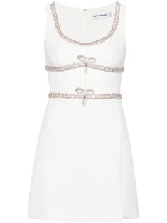 White bonded crepe mini dress with diamond bows from Self-Portrait, featuring a zip fastening on the back, cut-out detail on the front and Diamanté finishing. Dress With Crystals, Embellished Shorts, Diamond Bows, Bow Brooch, Self Portrait Dress, Crystal Trim, Chic Party, White Bow, White Crystal