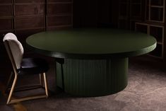 a green table with two chairs next to it