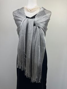 This versatile shimmery shiny shawl with fringe can be used to dress up an outfit for a special evening, a wedding or as a neck scarf in spring. Effortlessly give a dress a new look by simply adding this shawl. Perfect as bridesmaid gifts or wedding favours, the perfect gift for any occasion. This is not a very large shawl. There is metallic thread woven in the shawl that gives shining shimmery look.  Measures 20"Wx 75" The colours are very close however not exact. I tried to to capture the colo Elegant Fringe Shawl Scarf, Elegant Fringed Shawl Scarf, Fringed Shawl For Party, Elegant Shawl For Summer Parties, Elegant One Size Fringe Shawl, One Size Elegant Shawl With Fringe, Elegant One Size Shawl With Fringe, Elegant Summer Shawl With Fringe, Elegant One-size Shawl With Fringe