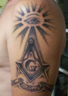 an illuminate tattoo on the back of a man's arm with masonic symbols