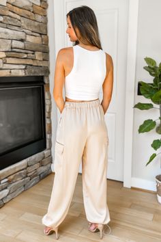 Trendy and comfy! Our Just For You Satin Cargo Pants in Champagne feature an elastic waistband with drawstring, cargo pockets, side pockets, and an adjustable hem with drawstring cords at cuffs. Also available in black. True to size. 98% Nylon, 2% Spandex. Model Measurements: Height 5'5", Bust 33", Waist 25", Hips 33" wearing a size Small. Satin Cargo Pants, Black Friday In July, Model Measurements, Cargo Pants, Champagne, Spandex, Satin, Elastic, Pants