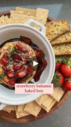 strawberry balsamic baked brie with crackers and strawberries on the side