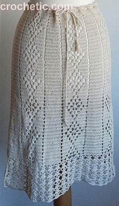 a white crocheted skirt on a mannequin