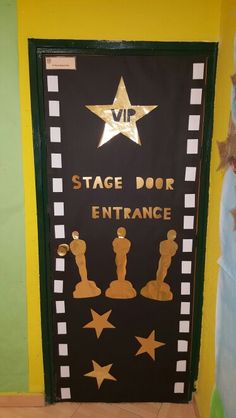 a door decorated with gold stars and the words stage door entrance