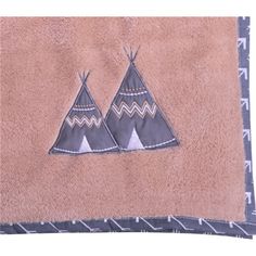 a towel with two teepees on it