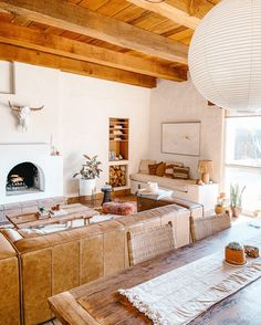 a living room filled with furniture and a fire place