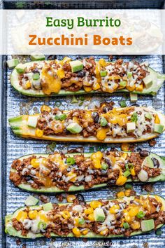 three stuffed zucchini boats on a baking sheet with cheese and other toppings