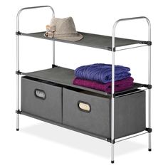 two storage bins with one shelf and the other is holding folded towels, blankets and a hat