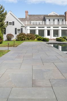 a large house with a pool in front of it