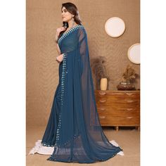 Teal Blue colored saree is prettified with beautiful embroidered butti work as shown which makes it appear classy. This saree is made of georgette fabric which is accompanied with banglori silk blouse piece which you can customise as per your design/style. Women can buy this saree to wear for their party and functions. Note:- The actual product may differ slightly in color and design from the one illustrated in the images when compared with computer or mobile screen Measurements: Saree : Georget Georgette Fabric, Georgette Sarees, Blouse Piece, Silk Blouse, Teal Blue, Saree, Silk, Fashion Design, Blue