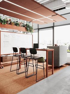 there are four chairs at the table in this office meeting room with a whiteboard on the wall