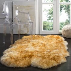 an animal skin rug on the floor in front of a window