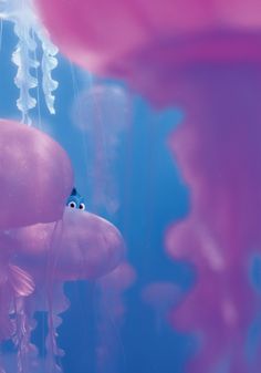 an underwater scene with jellyfish and other sea creatures in the water, as well as text that reads disney pixar