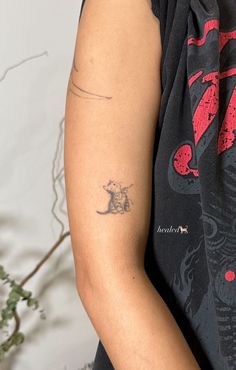 a woman with a tattoo on her arm