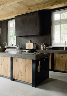 a kitchen with wooden cabinets and an island in front of the stove top is shown