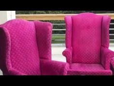 two pink chairs sitting next to each other