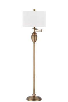 a gold floor lamp with a white shade