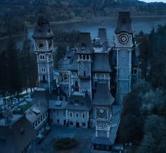 an aerial view of a large building with two towers