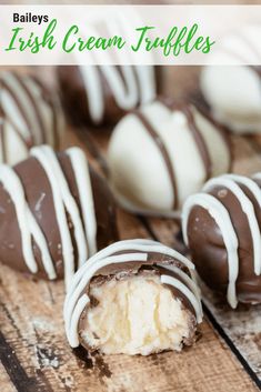 several chocolate covered desserts on a wooden table