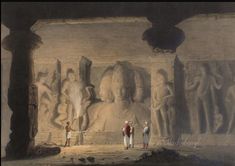 two men standing in front of a large statue with other figures behind them and another man looking at it