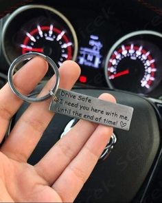 someone holding a keychain that says drive safe, i need you here with me until the end of time