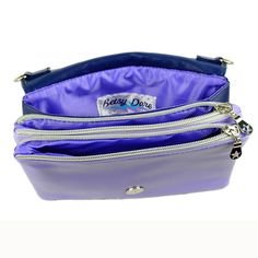 Reminiscent of twilight skies and purple nightshade flowers, our Stella clutch has room to carry your essentials for an evening out or a day strolling the city, and easily converts from clutch to size-inclusive belt bag to shoulder bag with our unique 4-section chain. With two zipper pouches and one open pouch, this little beauty was designed to have room for any phone, a slim wallet, your car keys, lipstick, period gear, or other little necessities. Made of soft, smooth vegan leather in dusk-in Purple Evening Bags With Removable Pouch, Purple Clutch Bag For Everyday Use, Purple Clutch For Travel, Purple Evening Shoulder Bag With Adjustable Strap, Purple Shoulder Bag With Adjustable Strap For Evening, Purple Clutch With Removable Pouch For Daily Use, Purple Rectangular Clutch For Travel, Purple Clutch Bag With Detachable Strap, Purple Clutch Shoulder Bag With Detachable Strap