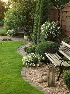 a wooden bench sitting in the middle of a garden