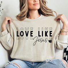 Love Like Jesus Sweatshirt, Religious Sweatshirt, Positive Quotes, Christian Sweatshirt, Inspirational Sweatshirt, Jesus Sweatshirt HOW TO ORDER 1-) Please, check and review all photos 2-) Choose your item size and color 3-) Click add to cart. You can go back to add more product 4-)Click "Proceed to check out" 5-)When you check out, you can add a note to seller for any request PRODUCT FEATURE It's a 50% Cotton /50% polyester, 13.5oz fleece. It features a double-needle collar, shoulders, and armh Comfortable Long Sleeve T-shirt With Text Print, Comfortable Long Sleeve Slogan T-shirt, Jesus Sweatshirts, Quotes Christian, Love Like Jesus, Trendy Shirt Designs, Christian Sweatshirt, Product Feature, Fashion Group