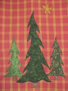 three trees on a red and yellow plaid background