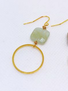 Handmade in Portland, Oregon. This will make the perfect gift! Or, definitely get it for yourself, I support that, too. MEASUREMENTS + MATERIALS - Length is about 1.5 inches - Pretty raw aquamarine gemstone - Hoop is about 1 inch in diameter - Gold fill ear wire for sensitive skin (hypoallergenic) WHAT PEOPLE SAY “Beautiful craftsmanship, these were for my mother in law, she loves them. I love supporting small businesses.” - Josh “ Love these earrings!! I get so many compliments about them when Handmade Modern 14k Gold Filled Jewelry, Modern Wire Wrapped Round Jewelry, Modern Round Wire Wrapped Jewelry, Handmade Gold Aquamarine Earrings, Minimalist Gold Aquamarine Jewelry, Aquamarine Round Jewelry With Matching Earrings, Gold Wire Wrapped Jewelry In Circle Shape, Modern Wire Wrapped Hoop Earrings For Gift, Gold Wire Wrapped Circular Jewelry