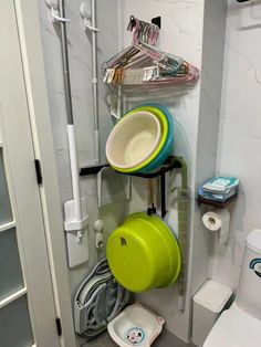 there is a bathroom with many items on the wall