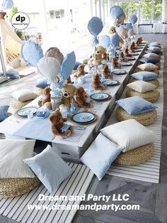 a table set up with teddy bears and balloons