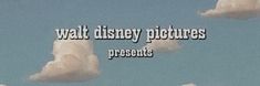 the words walt disney pictures present in front of some clouds