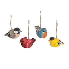 three small bird ornaments hanging from strings