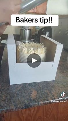 a person is cutting a cake in a box with the words bakers tip on it