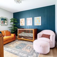 a living room filled with furniture and a baby crib