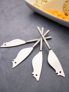 INOX named its mouse-shaped cheese spreader knives after Ratoncito Perez, the Spanish tooth fairy. Shown are the Jason Ratoncito spreaders with their square nascent steel "tails". Each set comes with 4 cheese spreader knives, wrapped in a cotton pouch for safe keeping and gift giving. Cheese Platters, Housewarming Party