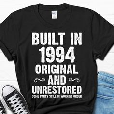 a black shirt that says built in 1994 and unrestored some parts still working order