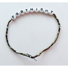 a beaded bracelet with the word fortnight written on it