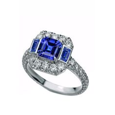 METAL SPECIFICATIONS White Gold 14K STONE SPECIFICATIONS Stone Name : Blue Sapphire and Diamond Stone Cut : Asscher, Emerald and Round Stone Details : There is one asscher cut sapphire approx. 2 carats (Approx. Size 6 x 6 mm), two emerald cut sapphires approx. 1 carat each (Approx. Size 6.4 mm), and approx. 0.50 carats of diamonds on the sides. Natural earth mined stones. Color : F Clarity : VS1 Quality of Sapphires : AAA Sapphire Treatment : Heated Total : Approx. 4.50 Carats RING SPECIFICATION Female Rings, Golden Ring, Asscher Cut, Pretty Rings, Natural Earth, Stone Cuts, 2 Carat, Sapphire Diamond, Diamond Stone